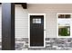 Close up of the home's front door flanked by windows and stone accents at 3957 Miller Rd, Salisbury, NC 28147