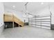 Spacious garage with stairs to an upper landing and a garage door at 3957 Miller Rd, Salisbury, NC 28147