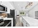Modern kitchen seamlessly connects to the living area, featuring stainless steel appliances, and a sleek center island at 3957 Miller Rd, Salisbury, NC 28147