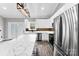 Spacious kitchen with stainless steel appliances, white cabinets and countertops, and an island for entertaining at 3957 Miller Rd, Salisbury, NC 28147