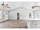An open floor plan seamlessly connects living room to kitchen area, bathed in natural light from an adjacent window at 3957 Miller Rd, Salisbury, NC 28147