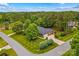 Expansive property with well-kept lawns, showcasing the home's setting amongst mature trees at 4159 Isle Of Pines Dr, Denver, NC 28037