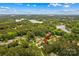 Overhead view showcasing the lush, wooded neighborhood surrounding a home near a lake at 4159 Isle Of Pines Dr, Denver, NC 28037