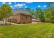 Well-maintained lawn showcasing a brick home with patio perfect for enjoying outdoor living and dining at 4159 Isle Of Pines Dr, Denver, NC 28037
