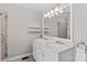 Bathroom featuring double sinks with a marble countertop and a large mirror at 4159 Isle Of Pines Dr, Denver, NC 28037