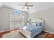 This bedroom has a large window and a beautiful blue comforter at 4159 Isle Of Pines Dr, Denver, NC 28037