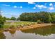Scenic community lake offers picnic tables, lounge chairs, a dock and natural beauty at 4159 Isle Of Pines Dr, Denver, NC 28037
