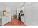 Well-lit kitchen with white cabinets and black appliances at 4159 Isle Of Pines Dr, Denver, NC 28037