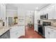 Kitchen showcasing a farmhouse sink and view of the dining area at 4159 Isle Of Pines Dr, Denver, NC 28037