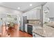 Bright kitchen with stainless steel appliances and dining area view at 4159 Isle Of Pines Dr, Denver, NC 28037