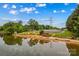 Scenic lake view featuring picnic areas, a sandy beach, and a tranquil waterfront at 4159 Isle Of Pines Dr, Denver, NC 28037