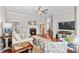 Spacious living room featuring a fireplace, hardwood floors, and comfortable seating at 4159 Isle Of Pines Dr, Denver, NC 28037