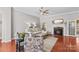 Cozy living room with fireplace, ceiling fan, and hardwood floors at 4159 Isle Of Pines Dr, Denver, NC 28037
