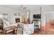 Spacious living room featuring a fireplace, hardwood floors, and comfortable seating at 4159 Isle Of Pines Dr, Denver, NC 28037