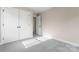 Bright bedroom with carpeting and a closet at 4219 Brownwood Nw Ln, Concord, NC 28027