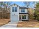 Charming two-story white home featuring a garage and a well-manicured lawn at 4219 Brownwood Nw Ln, Concord, NC 28027