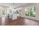 Bright, open kitchen featuring modern appliances, an island and light colored cabinets at 4219 Brownwood Nw Ln, Concord, NC 28027