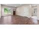 Spacious living room featuring lots of natural light and beautiful hardwood floors at 4219 Brownwood Nw Ln, Concord, NC 28027
