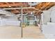 Spacious unfinished basement showing the concrete floors, a door, and exposed utilities; customize to your taste at 4445 Pioneer Dr, Hickory, NC 28601