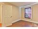 Bedroom featuring hardwood floors and a window at 4445 Pioneer Dr, Hickory, NC 28601