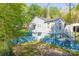 Home featuring fresh exterior paint, mature landscaping, and a side entry basement at 4445 Pioneer Dr, Hickory, NC 28601
