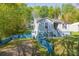Home featuring fresh exterior paint, mature landscaping, and a side entry basement at 4445 Pioneer Dr, Hickory, NC 28601