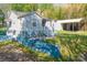 Home featuring fresh exterior paint, manicured landscaping, and a detached carport in the rear at 4445 Pioneer Dr, Hickory, NC 28601