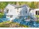 Home featuring fresh exterior paint, mature landscaping, and a side entry basement at 4445 Pioneer Dr, Hickory, NC 28601