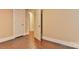 Hallway view with white trim and hardwood flooring at 4445 Pioneer Dr, Hickory, NC 28601