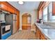 Eat-in kitchen with wood cabinets, stainless appliances, updated floors, and great natural light at 4445 Pioneer Dr, Hickory, NC 28601