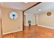 Spacious living room with hardwood floors, neutral walls, and a connecting doorway to other rooms at 4445 Pioneer Dr, Hickory, NC 28601