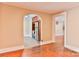 Spacious living room featuring hardwood floors and entryways to the kitchen and other rooms in the house at 4445 Pioneer Dr, Hickory, NC 28601