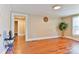 Spacious living room with hardwood floors and an open doorway with access to other rooms in the home at 4445 Pioneer Dr, Hickory, NC 28601