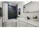 Modern bathroom featuring black marble tile shower, white vanity, and contemporary fixtures at 4607 Crewe Hall Ln, Waxhaw, NC 28173
