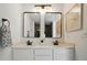 Bathroom vanity with double sinks, black faucets, and framed mirrors at 4607 Crewe Hall Ln, Waxhaw, NC 28173