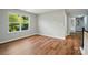 Bedroom with wood-look floors and a large window offering bright, natural light at 4607 Crewe Hall Ln, Waxhaw, NC 28173