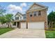 Lovely exterior showcasing a two-story home with a two-car garage and welcoming porch at 4607 Crewe Hall Ln, Waxhaw, NC 28173