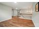 Bright hallway featuring hardwood floors, a staircase, and an elegant chandelier at 4607 Crewe Hall Ln, Waxhaw, NC 28173