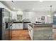 Modern kitchen with white cabinets, stainless steel appliances, a center island, and sleek countertops at 4607 Crewe Hall Ln, Waxhaw, NC 28173