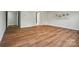 Open living room featuring wood-look floors, neutral walls and a view of doorways to other rooms at 4607 Crewe Hall Ln, Waxhaw, NC 28173