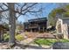 Spacious backyard with a deck, lush landscaping, and a charming outdoor space, perfect for relaxation and entertaining at 466 Shoreline Rd, New London, NC 28127