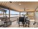 Charming screened-in porch with scenic lake views and a dining area, ideal for outdoor meals and relaxation at 466 Shoreline Rd, New London, NC 28127