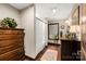 Bright bathroom featuring a shower, wood floors, and a classic neutral color palette at 466 Shoreline Rd, New London, NC 28127