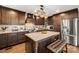 Modern kitchen with granite countertops, stainless steel appliances, a center island, and ample storage space at 466 Shoreline Rd, New London, NC 28127