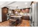 Spacious kitchen featuring stainless steel appliances, granite countertops, and a central island with seating at 466 Shoreline Rd, New London, NC 28127