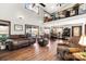 Bright and airy living room with ample seating, large windows, and an open view of the second story at 466 Shoreline Rd, New London, NC 28127
