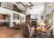 Cozy living room with a stone fireplace, vaulted ceilings, and an open view of the second story at 466 Shoreline Rd, New London, NC 28127
