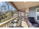 Relaxing screened-in porch featuring views of the surrounding neighborhood and a cozy seating area at 466 Shoreline Rd, New London, NC 28127