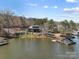 Stunning lakefront home with private dock and covered boat lift, offering serene waterfront living at 466 Shoreline Rd, New London, NC 28127