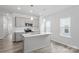 Bright kitchen with white cabinetry, stainless steel appliances, and a large center island at 4724 Lakeview Rd # 26, Charlotte, NC 28216